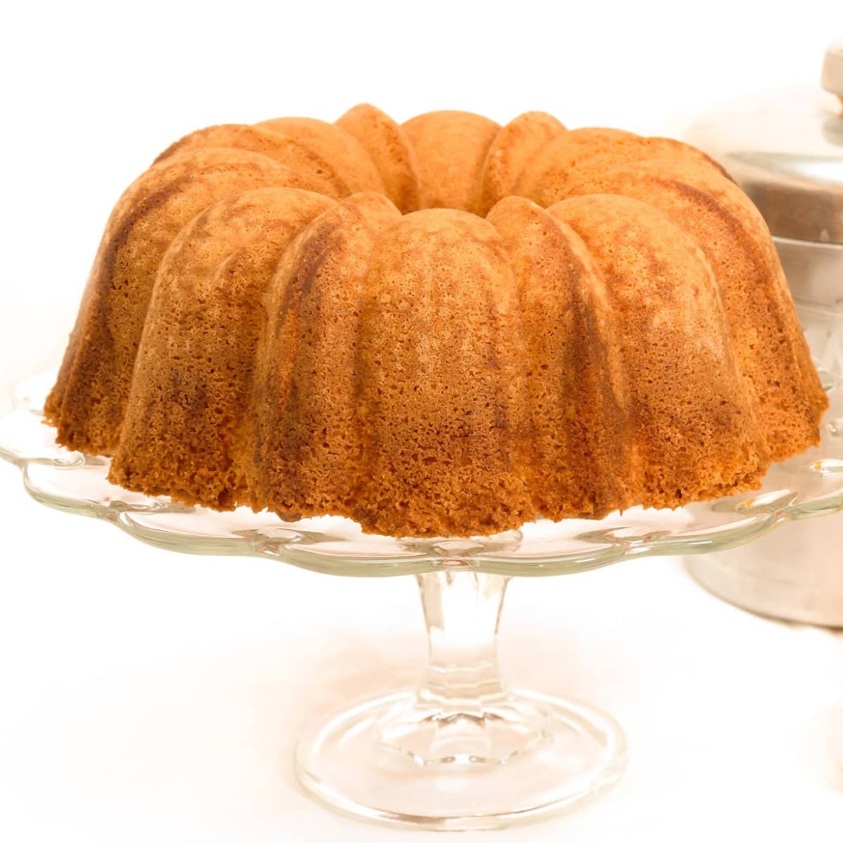 keto sour cream pound cake on a cake pedestal stand 1200