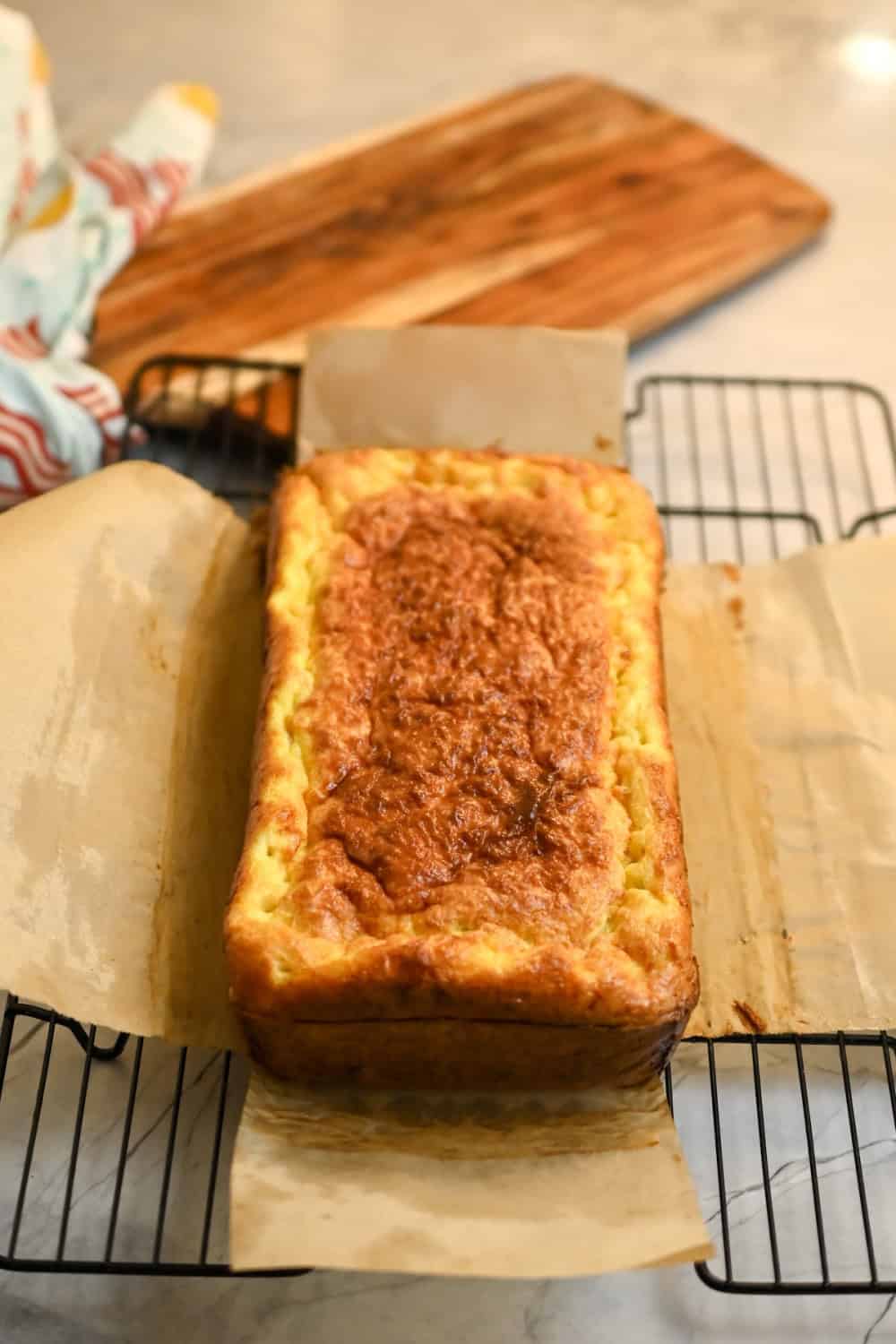 carnivore cream cheese bread cooling on a baking rack ready to be sliced