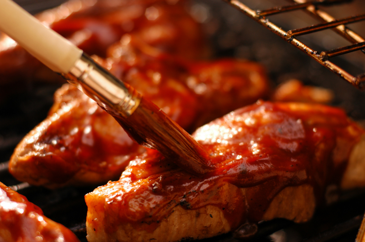 Sugar-Free Cranberry BBQ Sauce Being Added To Baked Chicken