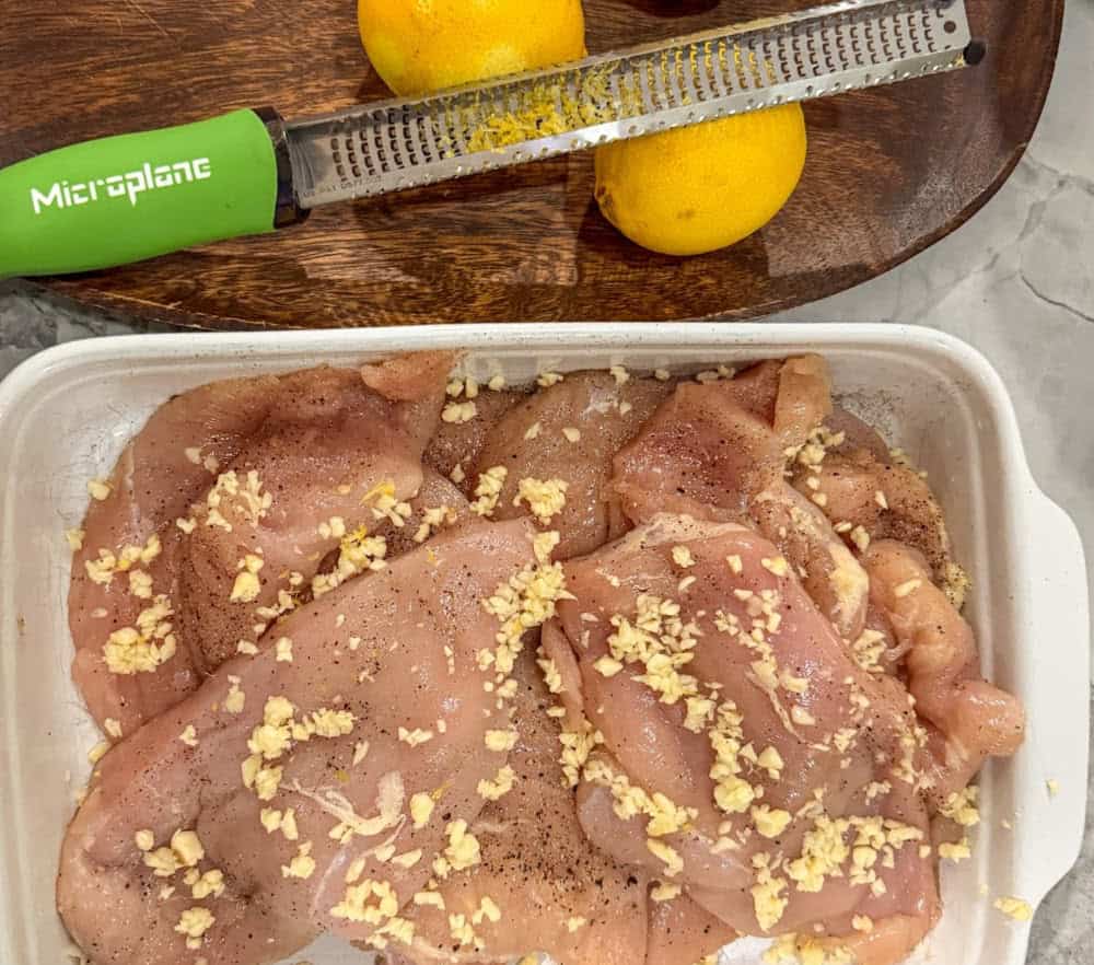 raw chicken being prepared for keto piccata
