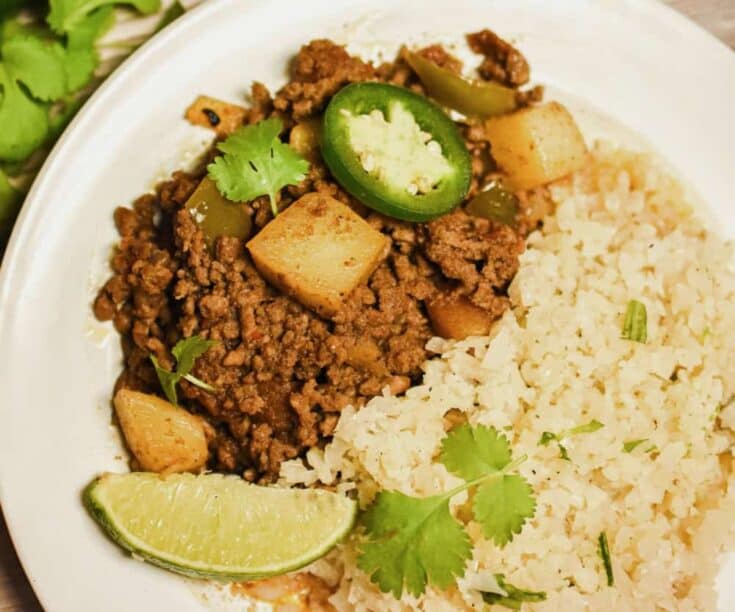 keto Mexican Picadillo served with cauliflower rice on a white plate