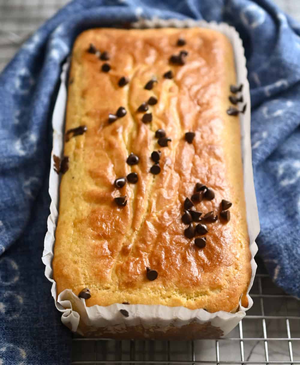 keto coconut flour chocolate chip pound cake cooling on a baking rack