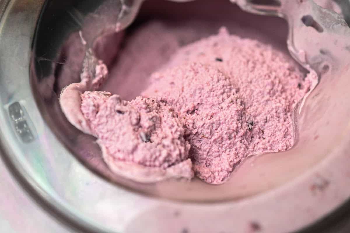 keto mixed berry ice cream being made in an ice cream maker