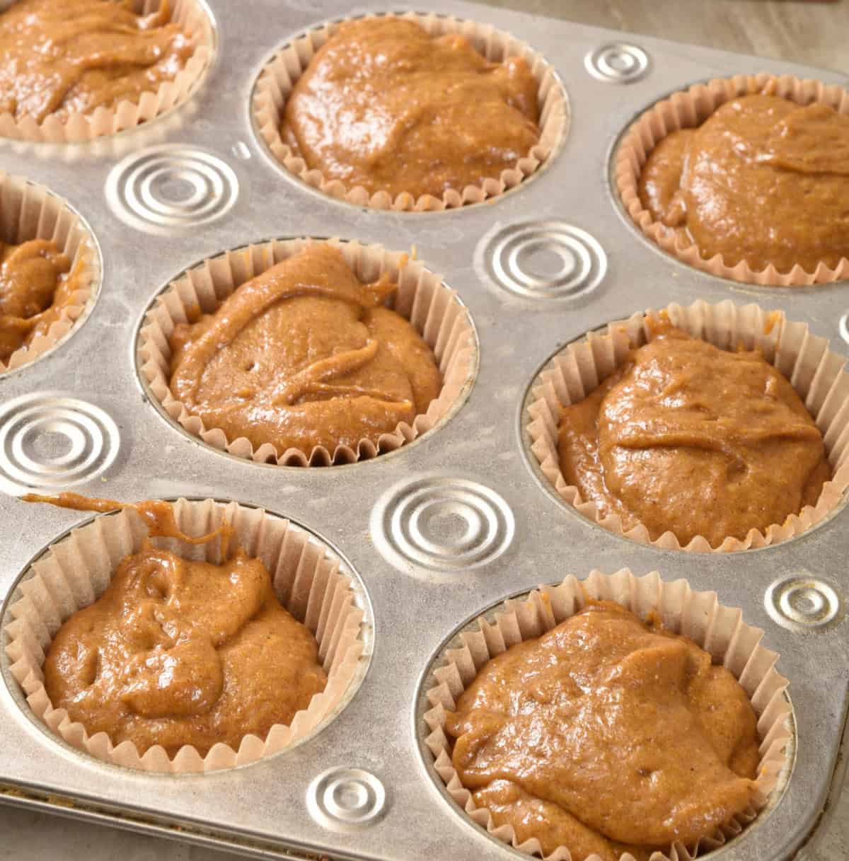 keto banana nut muffins ready for walnut topping before baking
