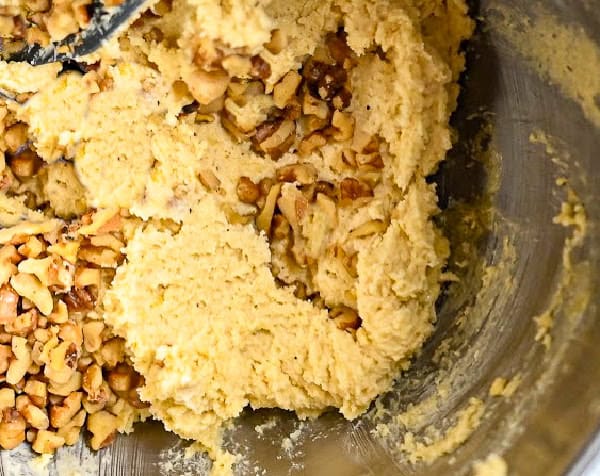 keto pecan sandie cookie dough in a large metal bowl